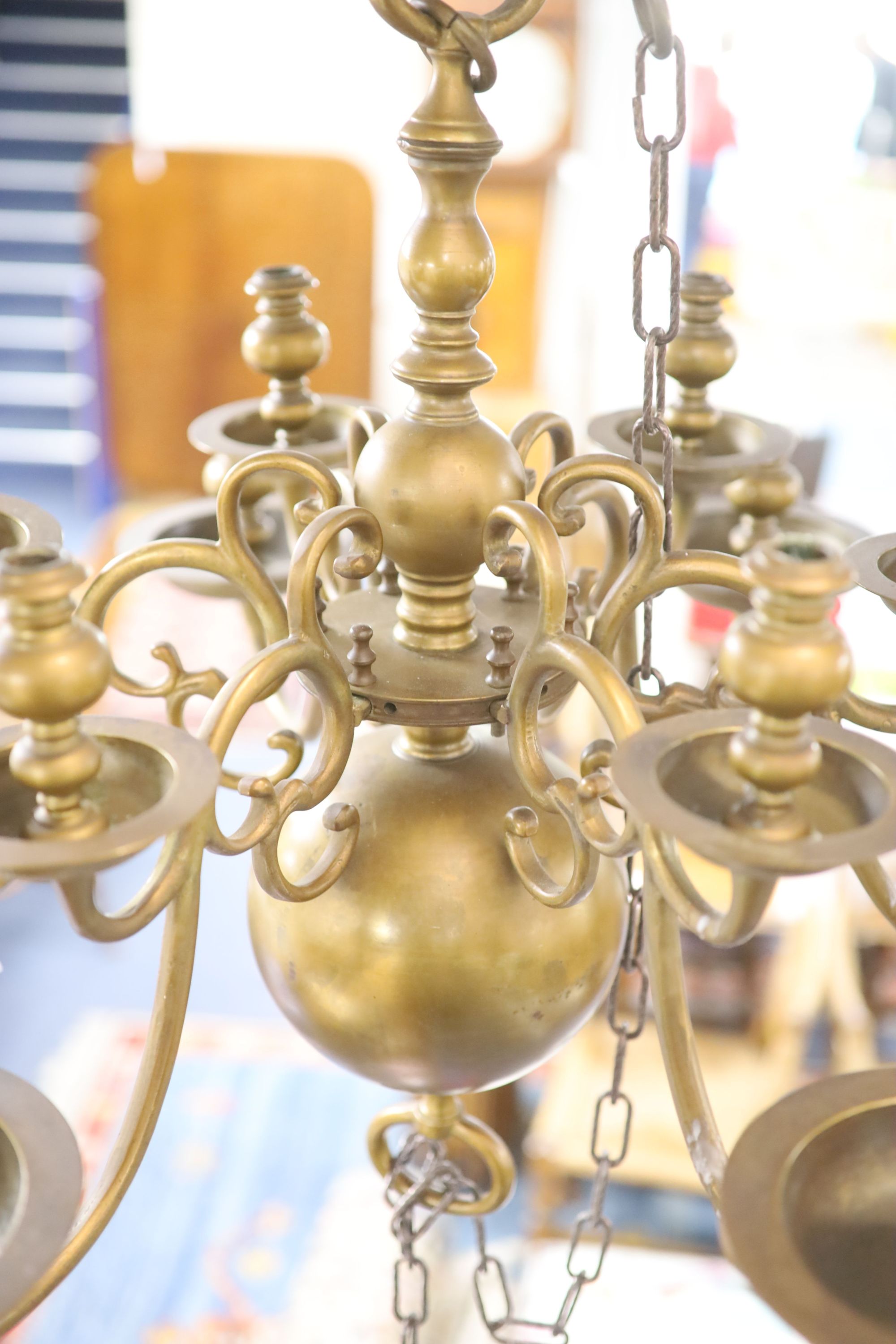 A 17th century style Dutch design brass six branch two tier ceiling chandelier